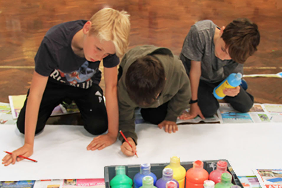 Collaboration. Boys painting together
