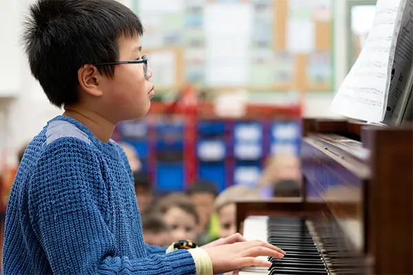 Boy playing piano