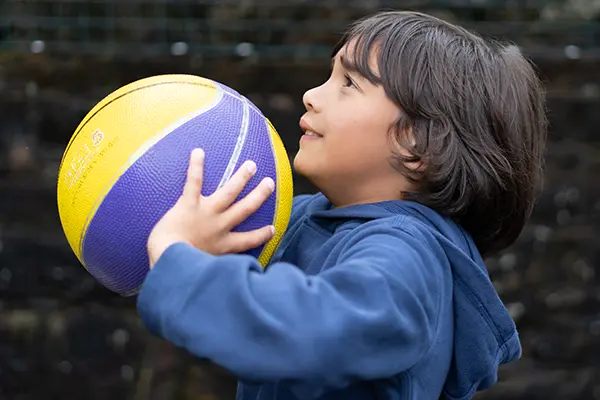 Child playing basketball