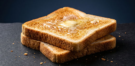 Two slices of buttered toast to illustrate Breakfast Club