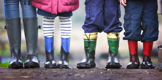 Row of feet in colourful wellington oots illustrating the Parent/Carer Engagement Offer